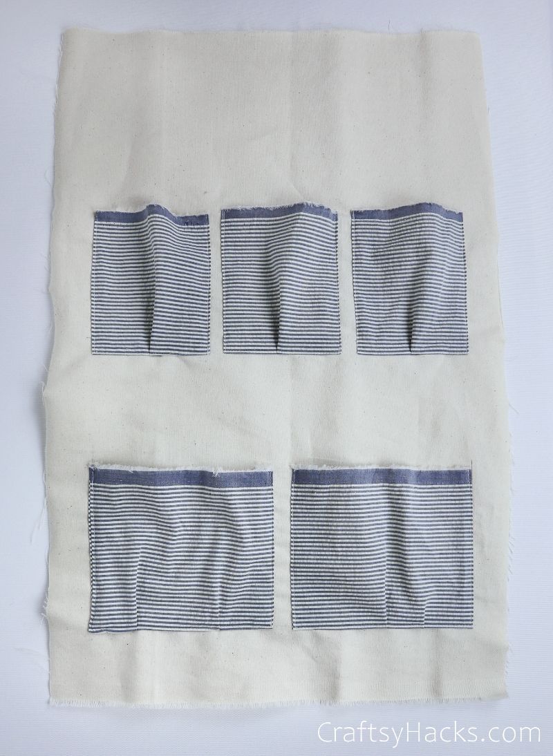 five pockets sewed onto fabric
